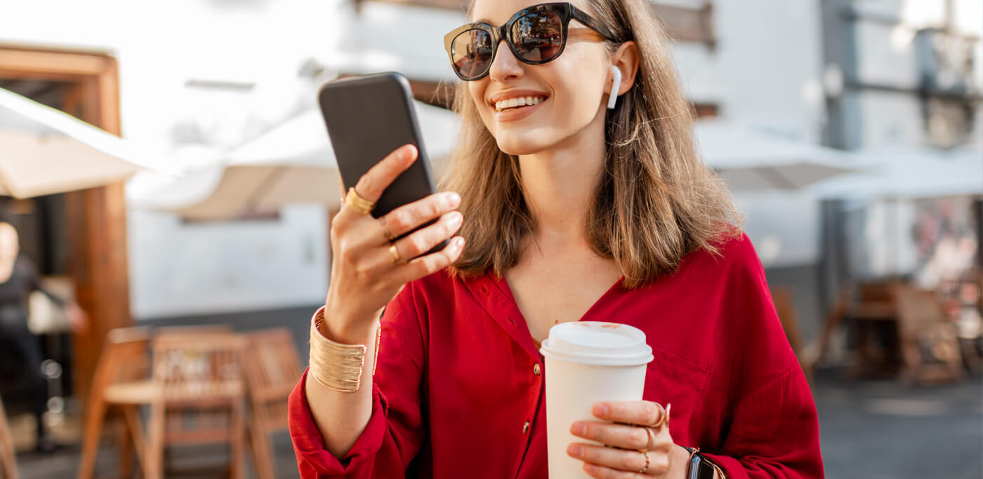 Happy women reading mobile phone