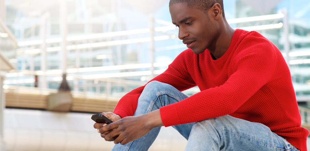 Man reading emails on mobile