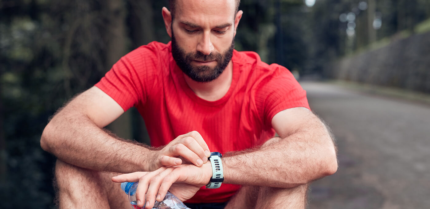 Runner checking his stats on watch