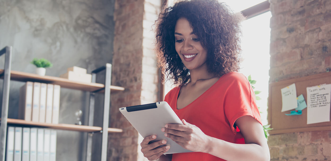 Women using a tablet standing up