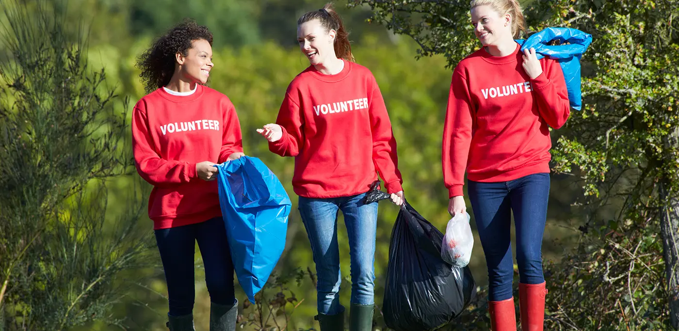 Volunteers picking up litter from a local park