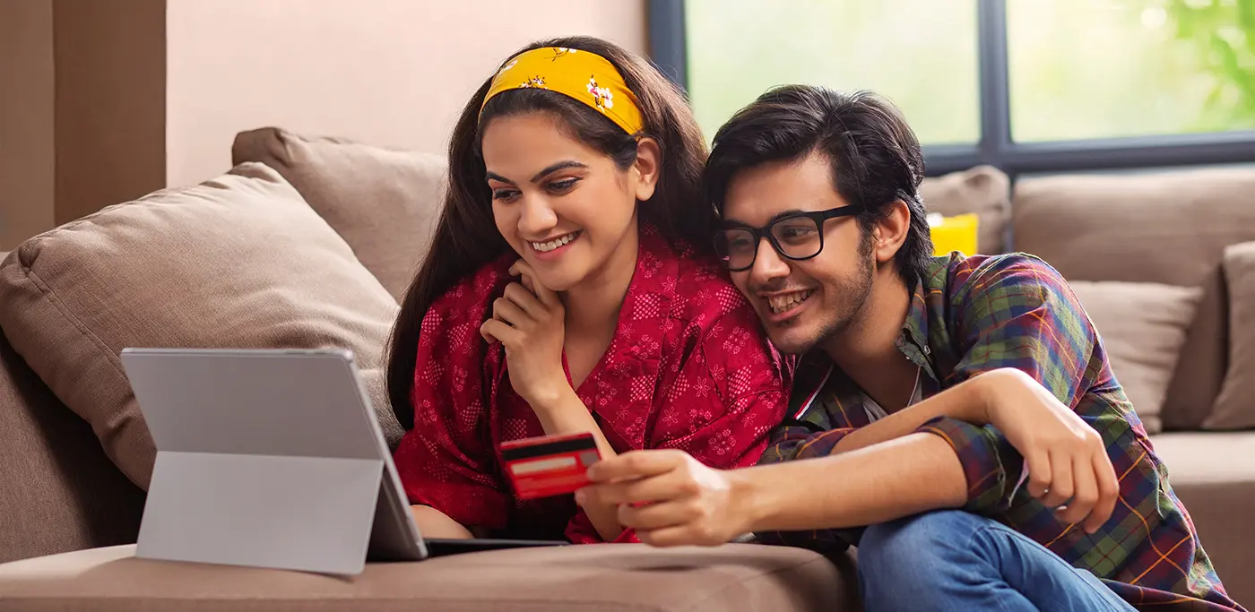 Asian man and women with credit card