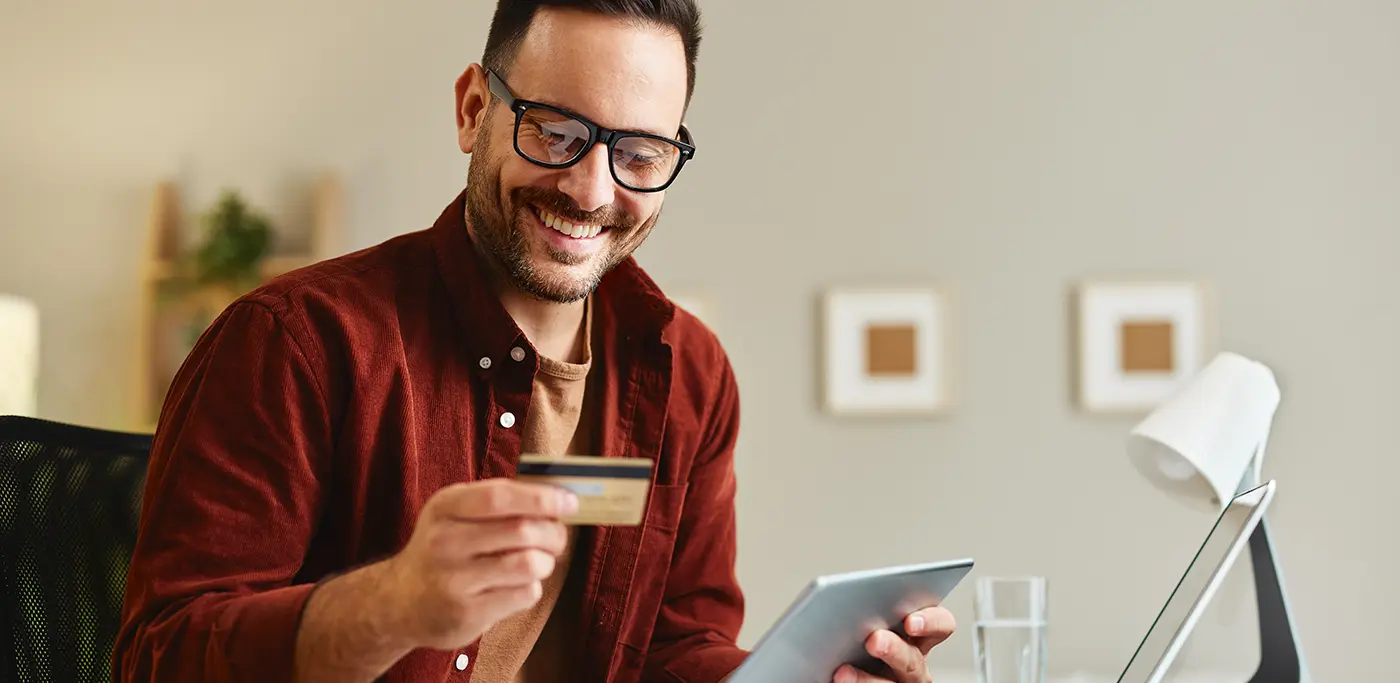 Man with credit card making a donation to charity