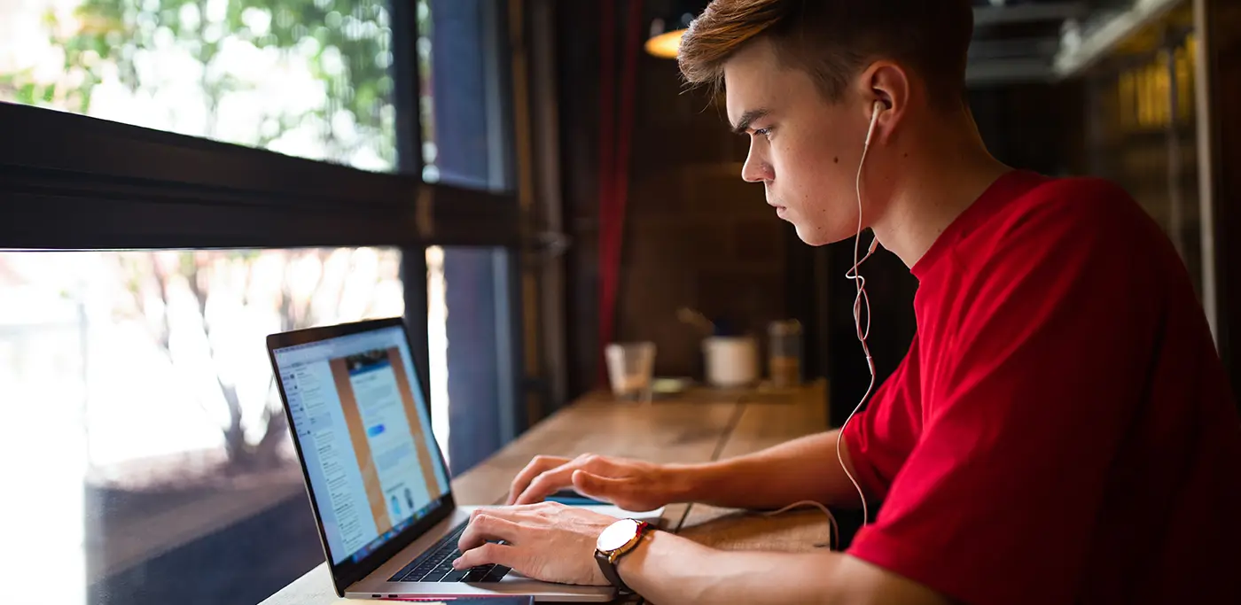 Student in the library on laptop