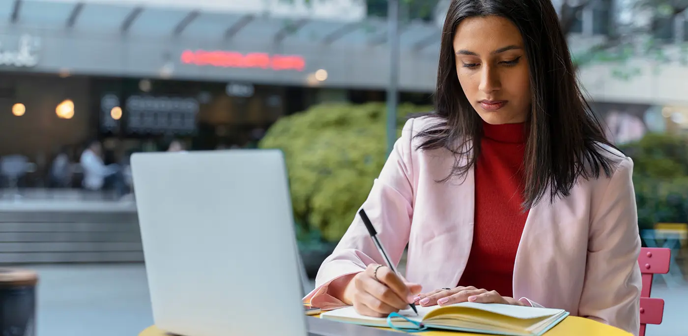 Uni student working hard on laptop