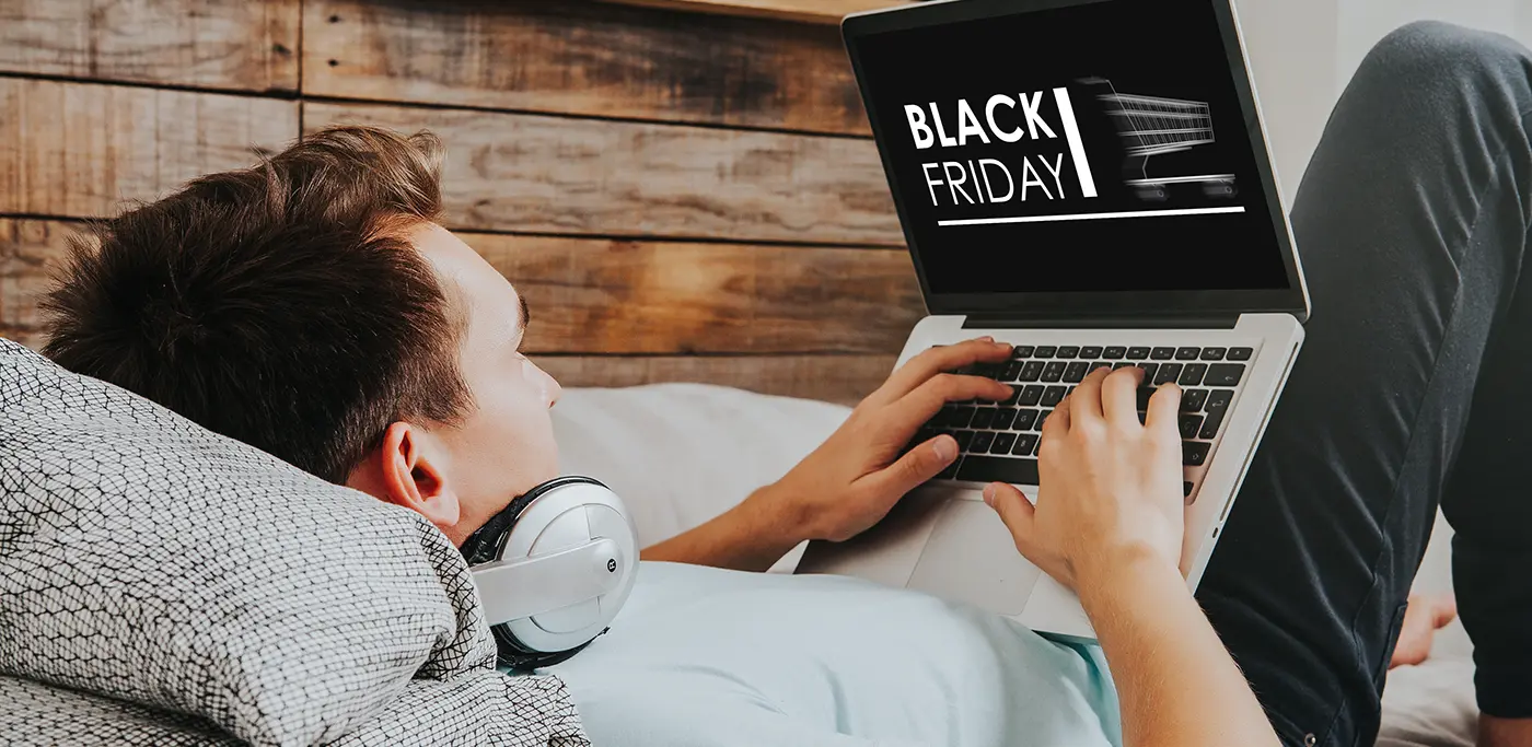 Man browsing black friday on his laptop